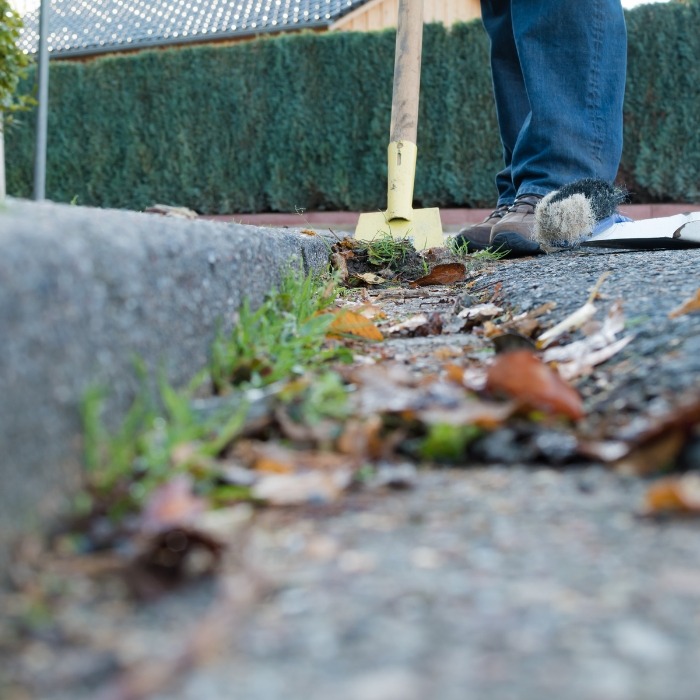 clearing debris from curb