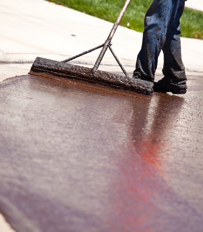 crew resurfacing asphalt